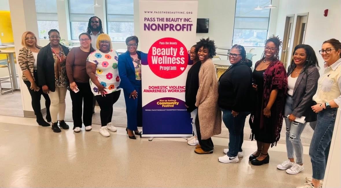 Pass the Beauty Inc. staff and volunteers at a Beauty & Wellness Domestic Violence Awareness Workshop